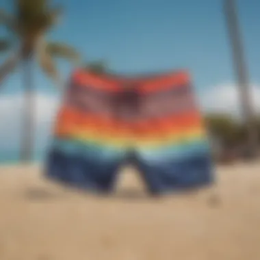 Vibrant boardshorts displayed on a sandy beach