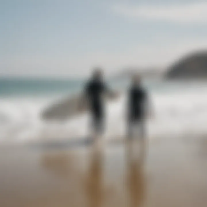 A surf instructor guiding a student on the beach