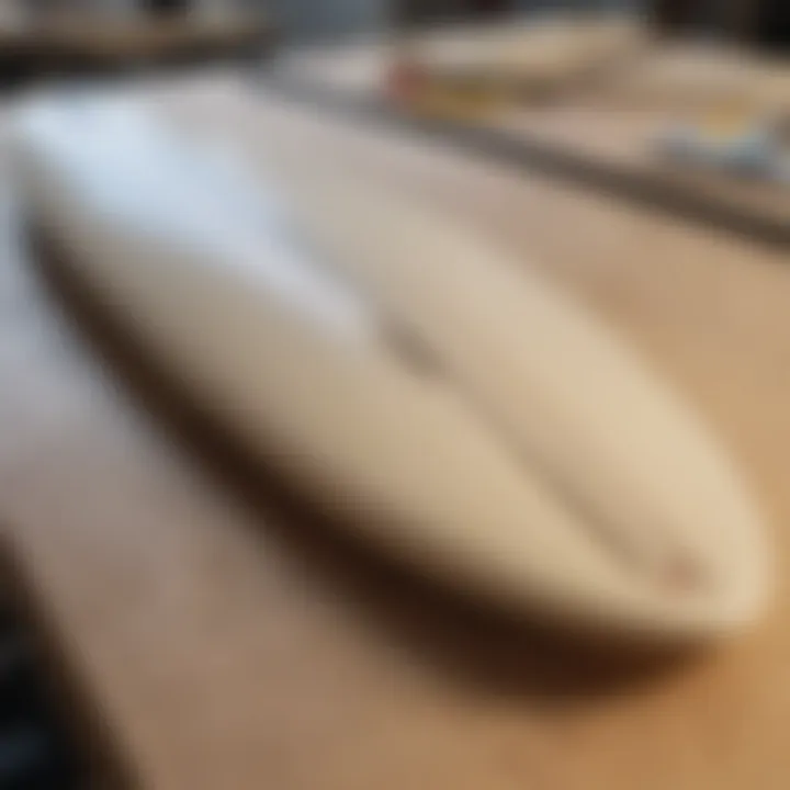 A close-up view of high-quality surfboard materials laid out on a workshop table