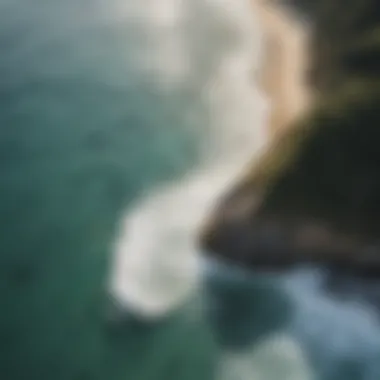 Aerial view of a picturesque coastline with surfers