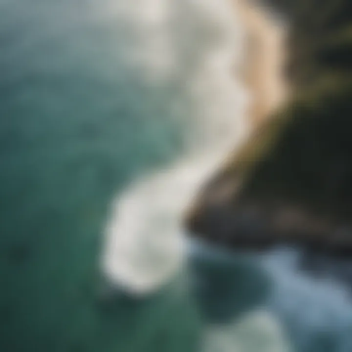 Aerial view of a picturesque coastline with surfers