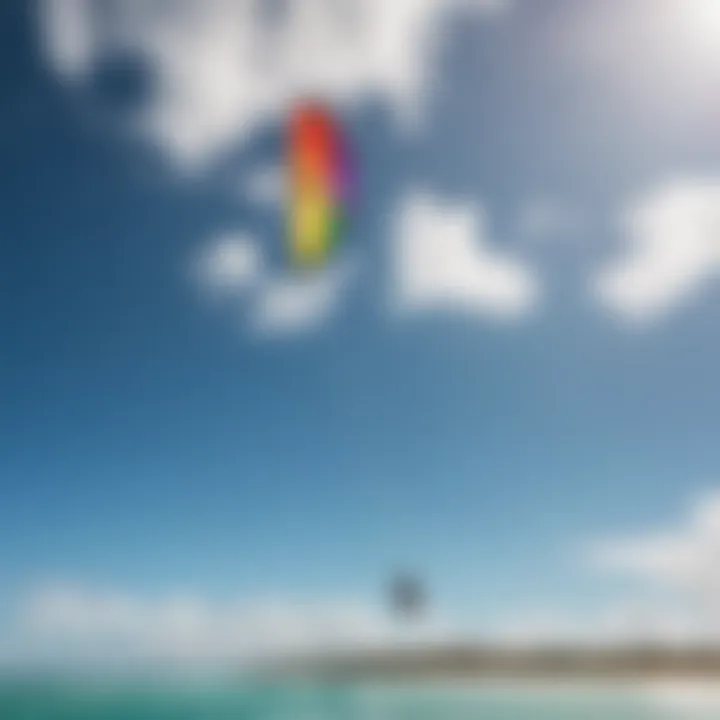 A vibrant kite soaring high against the blue sky during a kite surfing session