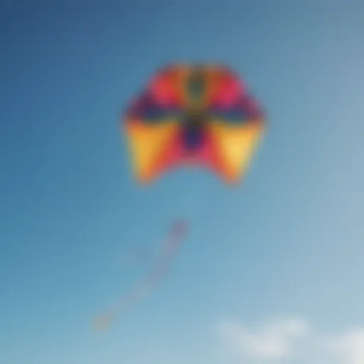 A vibrant large single line kite soaring high against a clear blue sky.