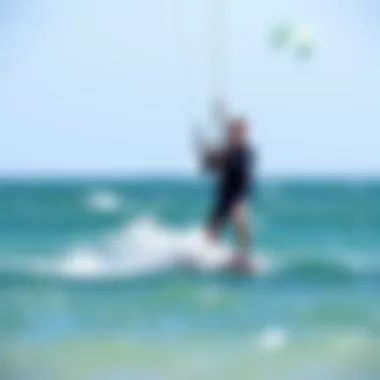 A novice practicing kitesurfing under supervision