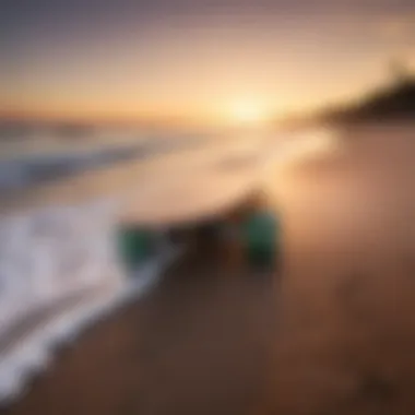 Close-up view of a longboard on the beach at sunset