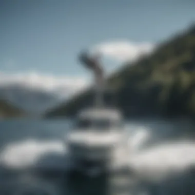 An athlete performing tricks while being towed by a boat with a ski tower.