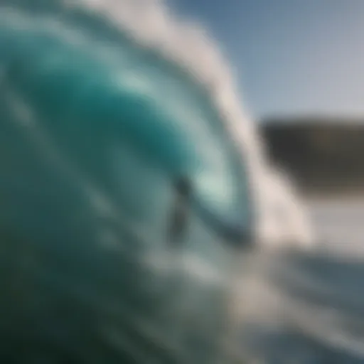 An impressive wave towering over a surfer ready to ride