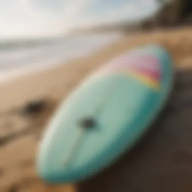 Close-up of a surfboard on the beach ready for action