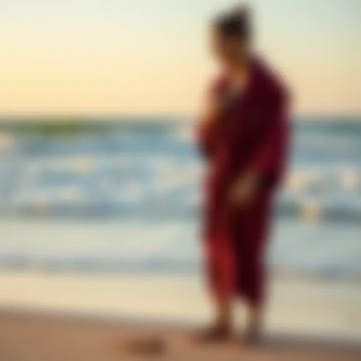 Surfer in a Robe on the Beach A serene beach scene with a surfer putting on a robe after a session