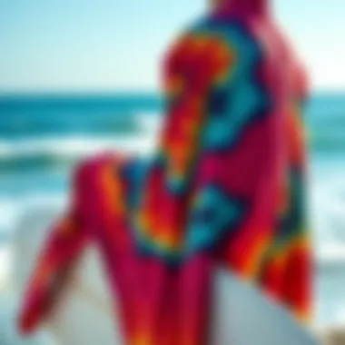 Vibrant Surfing Robe by the Ocean A vibrant surfing robe draped over a surfboard by the ocean