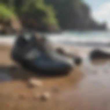 A pair of Olukai Pikoi on a rocky beach setting