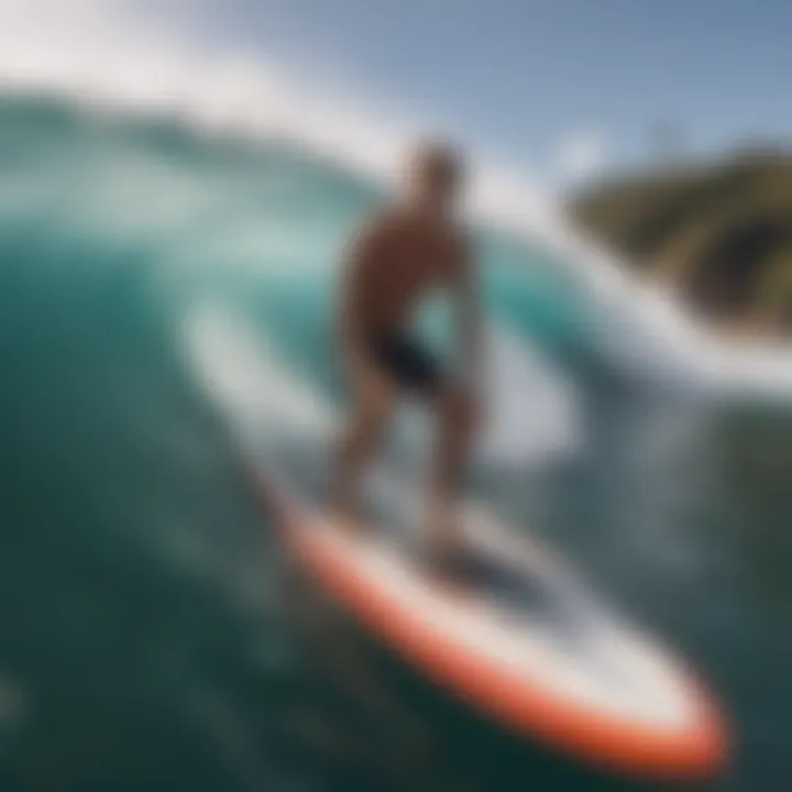 Surfer riding the Rocket Wide Surfboard