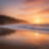 A stunning view of Santa Cruz beach with surfers catching waves under a vibrant sunset