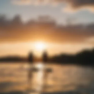 Two paddle boarders enjoying a sunset on the water