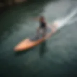 A sleek motorized paddleboard gliding across the water