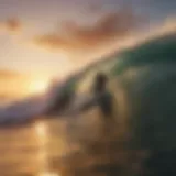 Surfer riding a wave at sunset