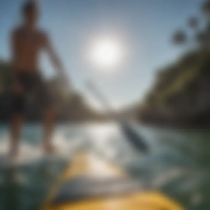 Close-up of a paddleboard paddle immersed in water, showcasing technique