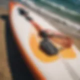 A vibrant key leash securely attached to a surfboard.