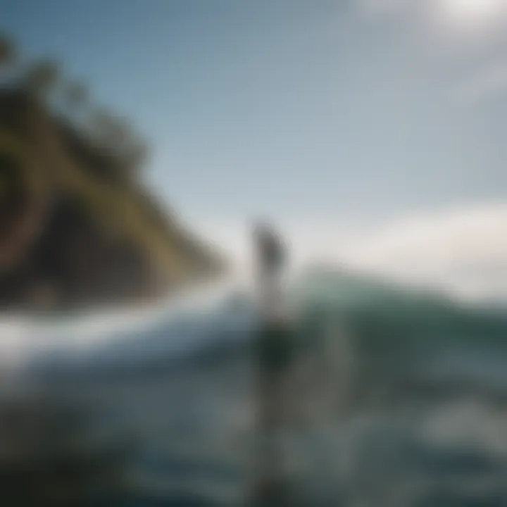 Dynamic action shot of a paddle boarder gliding over waves on a Thunder Wave inflatable paddle board