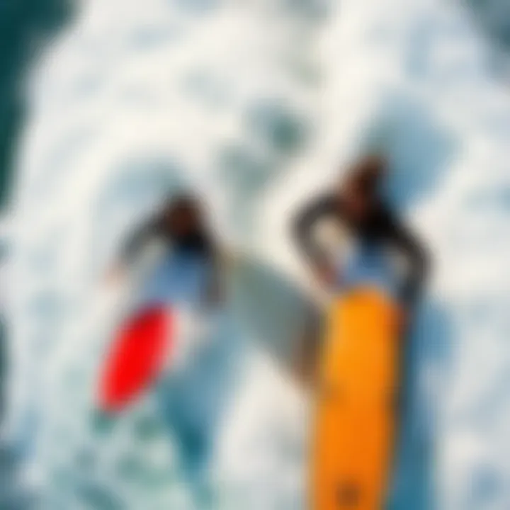 Surfers Riding Waves in Harmony Bird's eye view of surfers riding waves in harmony